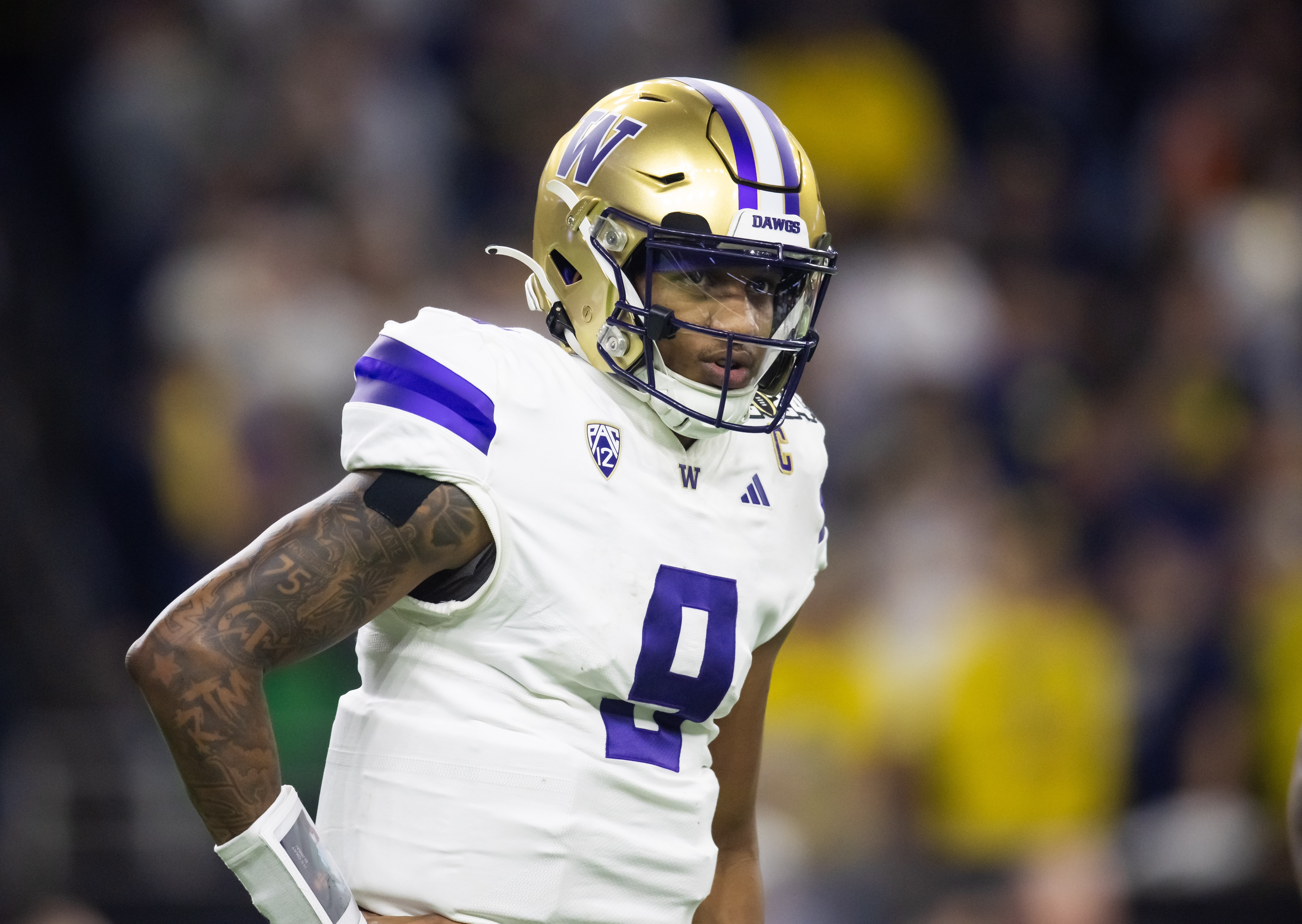 Jan 8, 2024; Houston, TX, USA; Washington Huskies quarterback Michael Penix Jr. (9) against the Michigan Wolverines during the 2024 College Football Playoff national championship game at NRG Stadium.